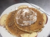 buttermilk pancakes topped with apple cinnamon sugar and whipped cream.jpg