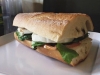 Fresh baguette local tomato and basil fresh mozzarella sprinkle of spinach drizzle of evoo and balsamic pressed perfectly