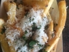 French fries topped with parmigiana reggiano cheese and fresh herbs