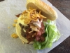 Double steamed cheeseburger topped with bacon Fritos chips, onion crunch lettuce and thousand island dressing